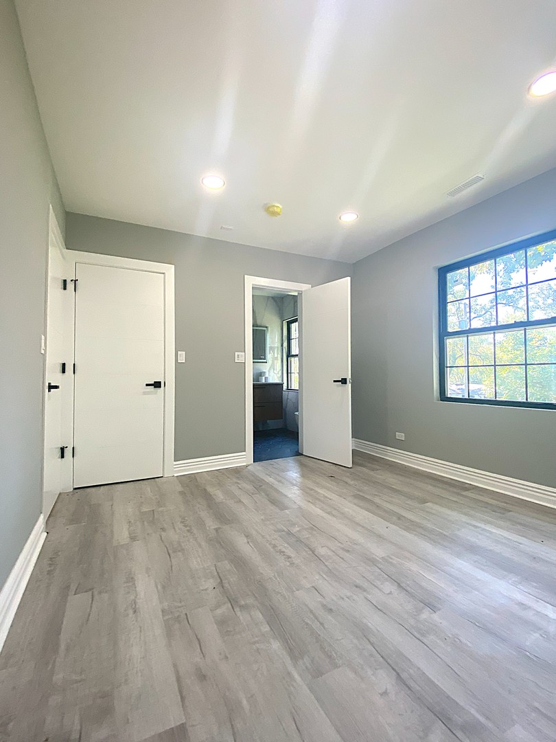 860 Green Bay Road Highland Park, IL 60035 - Photo 23 of 30 wooden floor in an empty room with a window