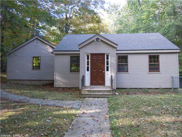 479 Merrow Road Tolland, CT 06084 - Photo 1 of 1 a front view of a house with garden