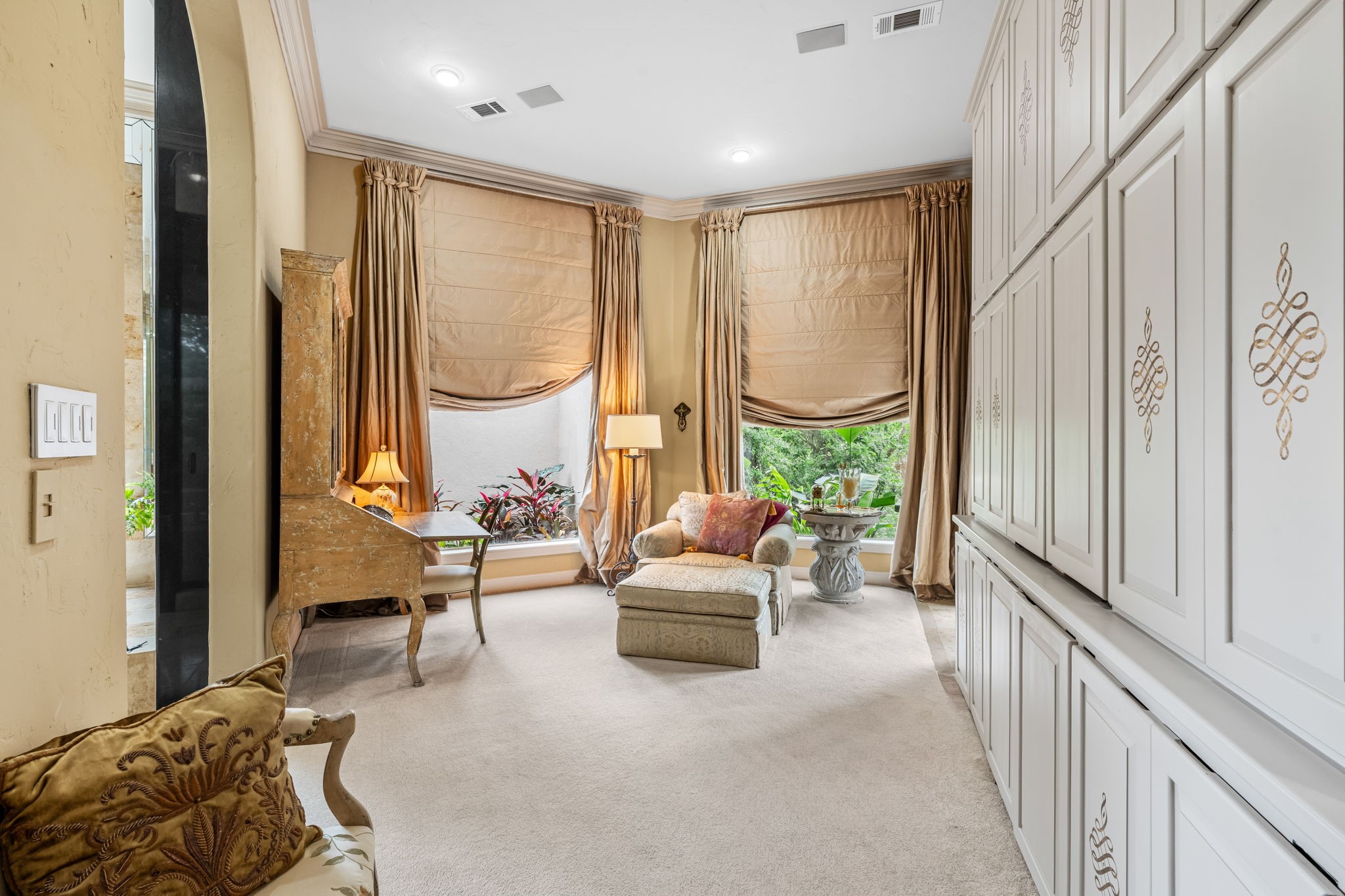 6 Mott Lane Houston, TX 77024 - Photo 19 of 50 Private office featuring custom built-ins, and elegant floor-to-ceiling drapery.
