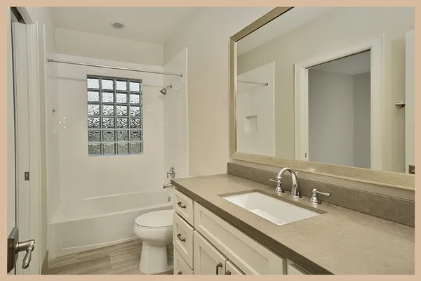 a bathroom with a sink toilet tub and shower