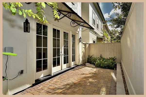 a view of a pathway along with potted plants