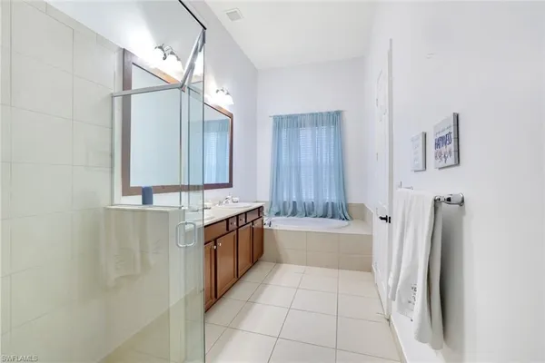 a bathroom with a bathtub and a sink