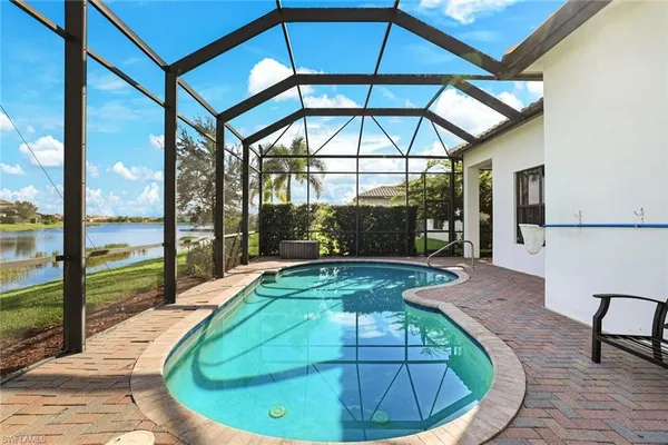 a view of a swimming pool with a lounge chairs