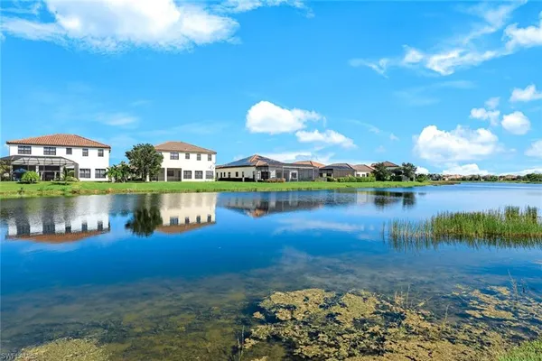 a view of a lake with a yard