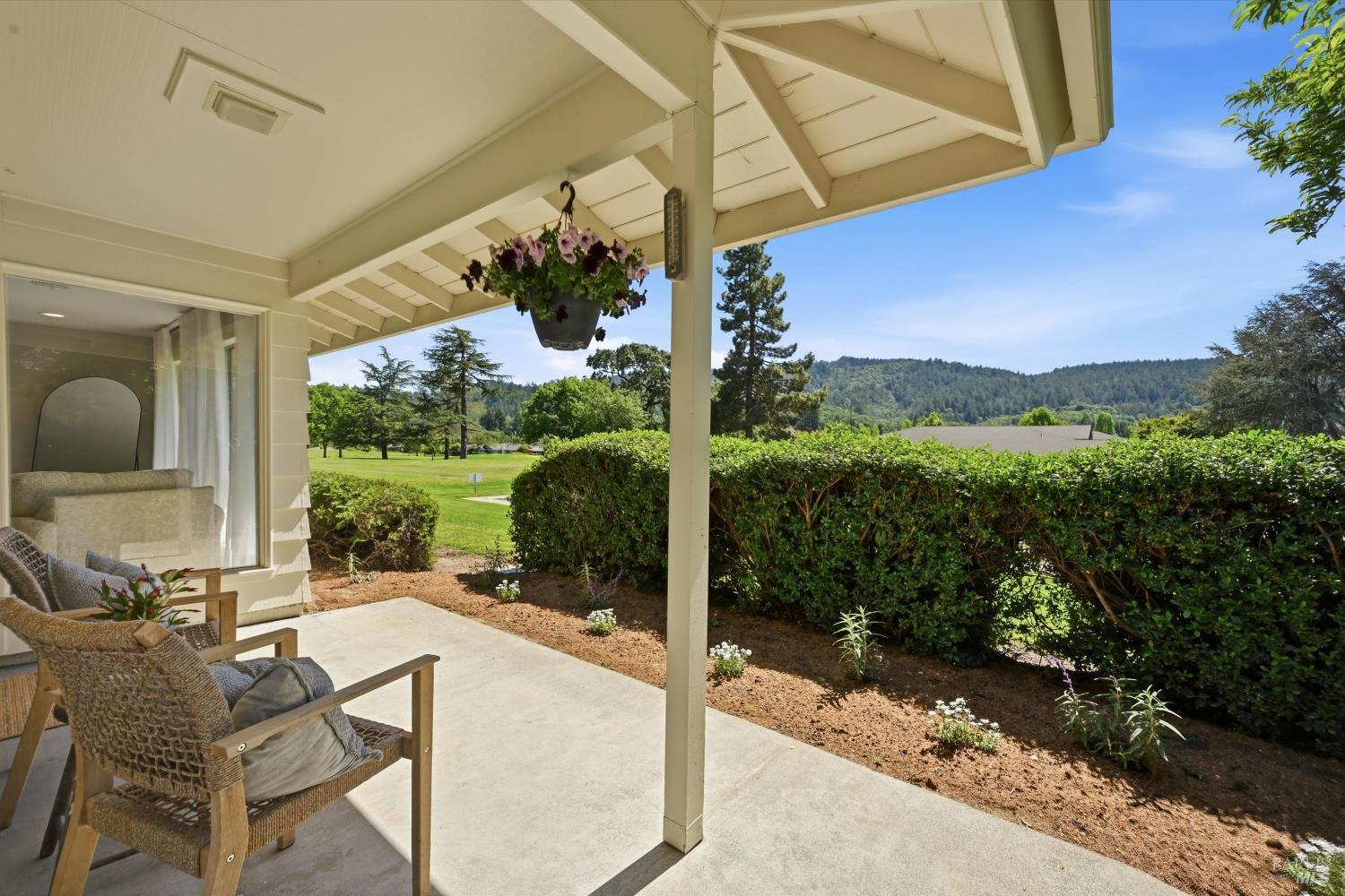 23 Valley Green Street Santa Rosa, CA 95409 - Photo 19 of 58 a view of a patio with table and chairs potted plants with wooden floor and floor to ceiling window