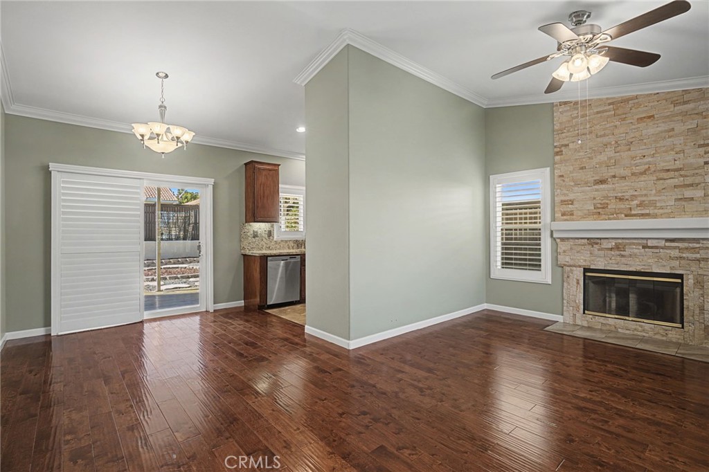 733 Daybreak Way Banning, CA 92220 - Photo 4 of 22 Beautiful wood floors fireplace and shuttered windows