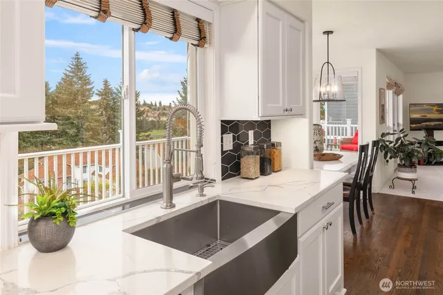 a kitchen with a large window and sink