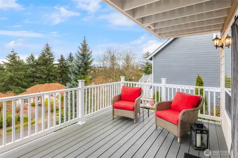 a sitting area with furniture on wooden deck