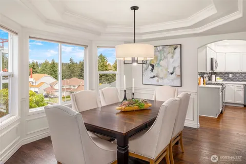 a view of a dining room with furniture window and wooden floor