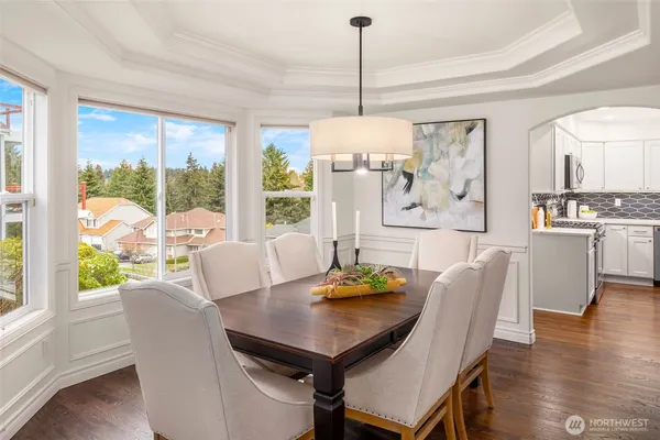 a view of a dining room with furniture window and wooden floor