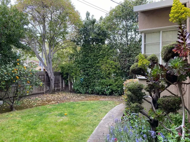a backyard of a house with lots of green space