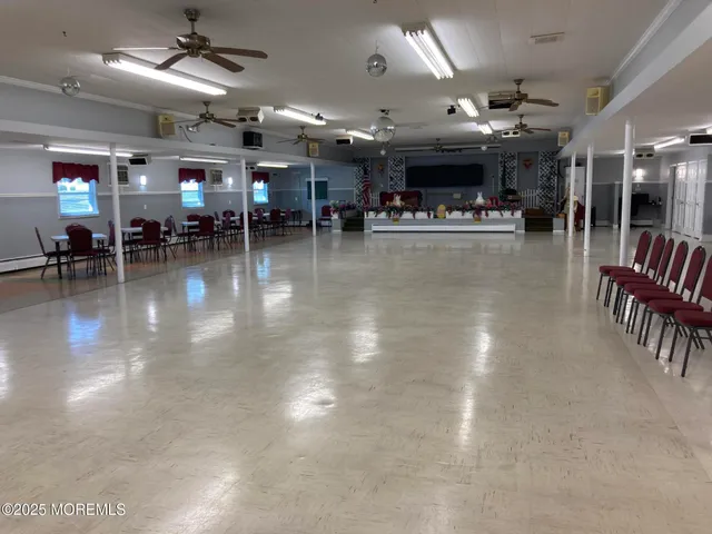 a view of a studio with lots of furniture