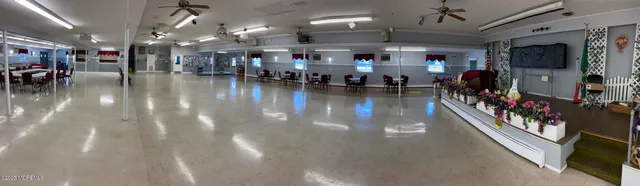 a group of people sitting in an empty room