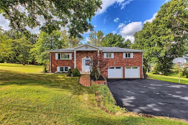 a front view of a house with patio yard and outdoor seating