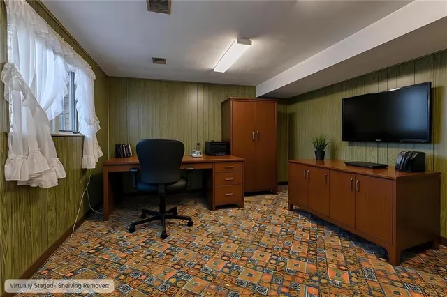 a bed room with a bed and a book shelf