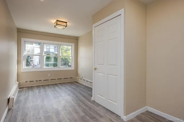 a bathroom with a bathtub sink and cabinets