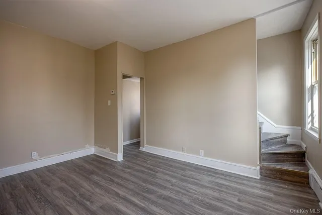 a bathroom with a toilet and a window
