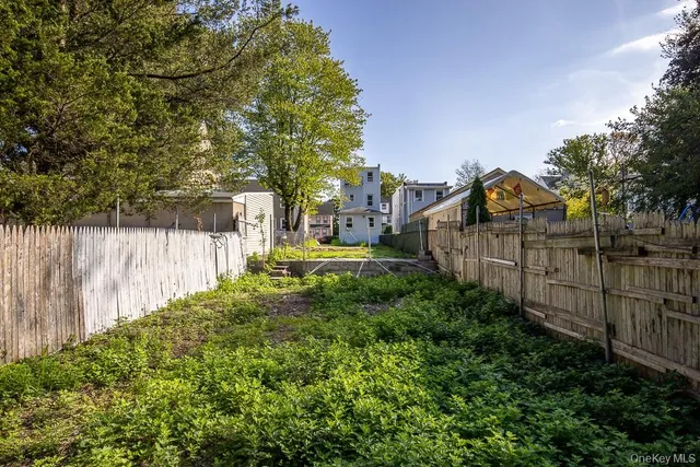a view of house with outdoor space and sitting area