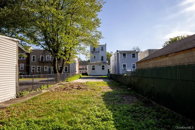 a view of a house with a small yard