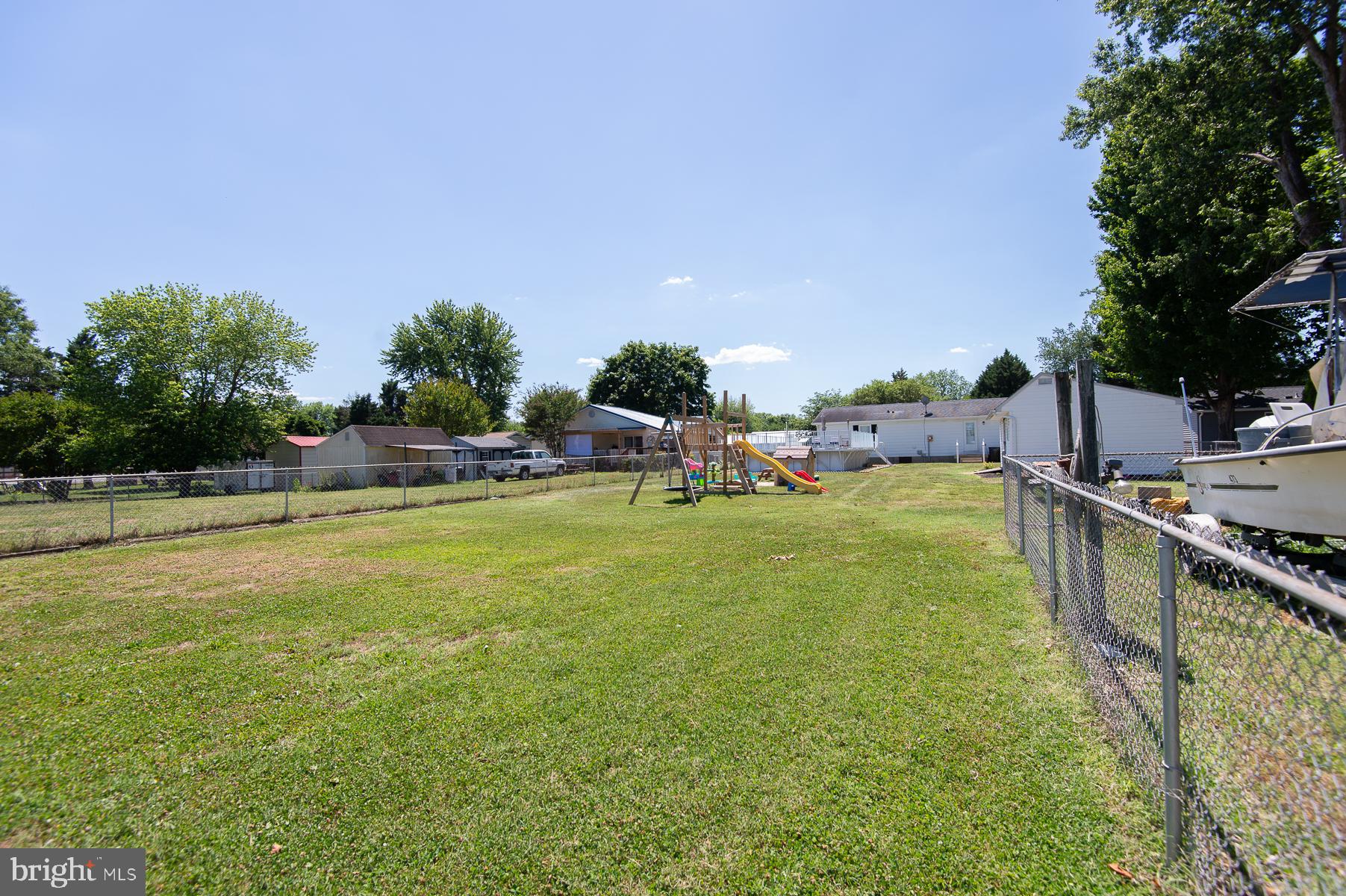 12 North Maple Avenue Ridgely, MD 21660 - Photo 8 of 30 a view of a swimming pool with a lawn chairs