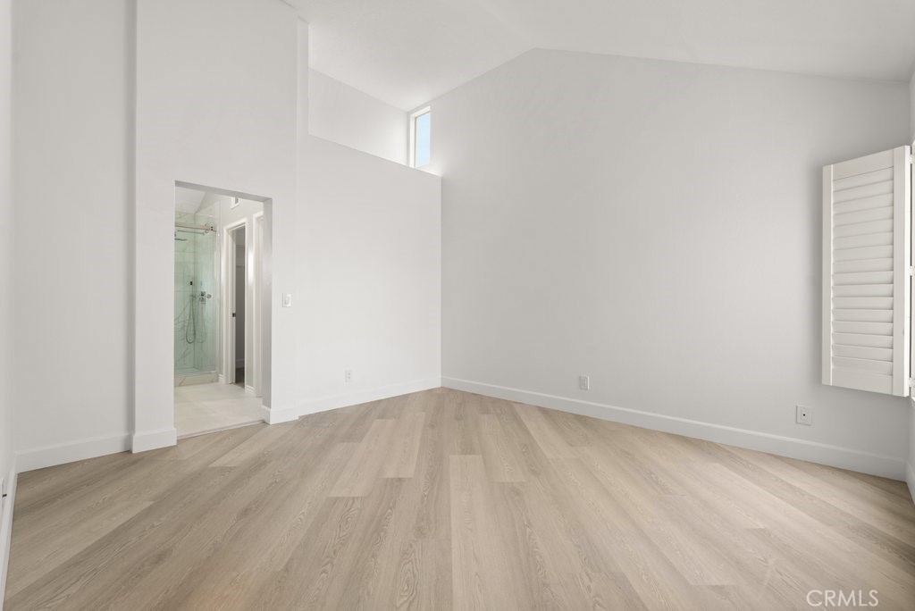 4 Las Cruces Irvine, CA 92614 - Photo 14 of 33 an empty room with wooden floor and windows