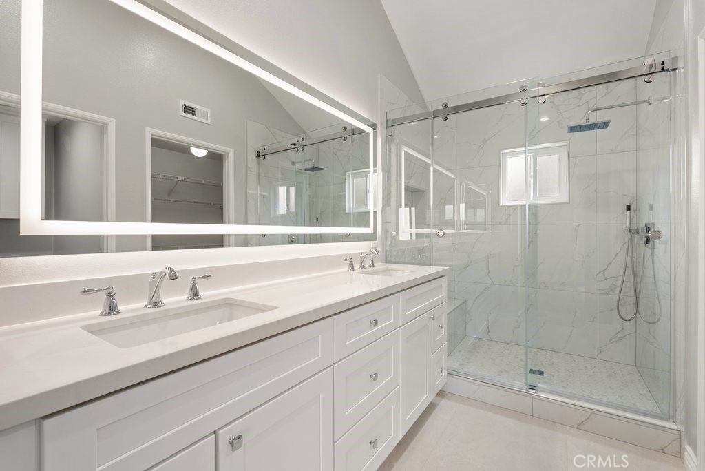 4 Las Cruces Irvine, CA 92614 - Photo 15 of 33 a bathroom with a shower sink and mirror
