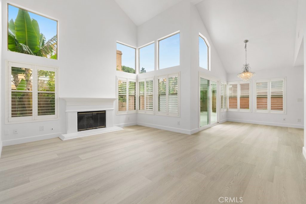 4 Las Cruces Irvine, CA 92614 - Photo 6 of 33 a view of an empty room with a fireplace and a window