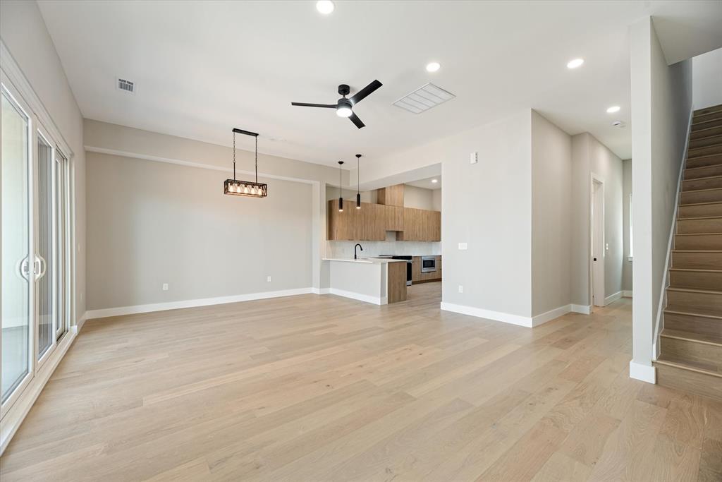 4060 Spring Valley Road, Unit 405 Farmers Branch, TX 75244 - Photo 3 of 10 Living Room with Hardwood Floors, and huge balcony.