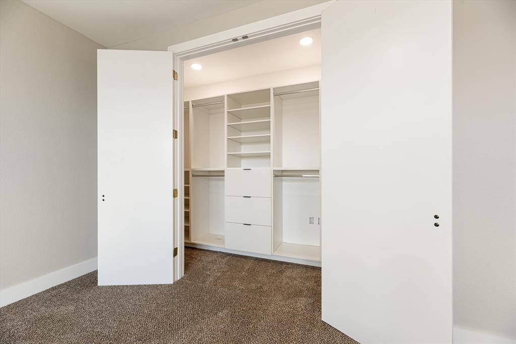 4060 Spring Valley Road, Unit 405 Farmers Branch, TX 75244 - Photo 8 of 10 Custom Closet in master bedroom