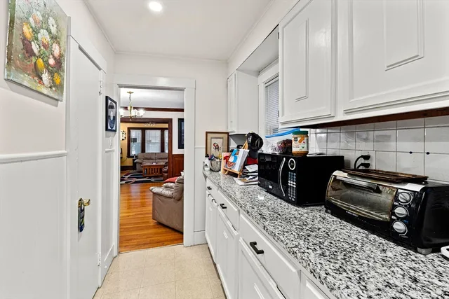 a kitchen with stainless steel appliances granite countertop a stove top oven a sink dishwasher and cabinets