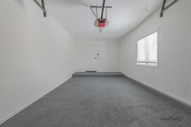 a view of a dry yard with a tree