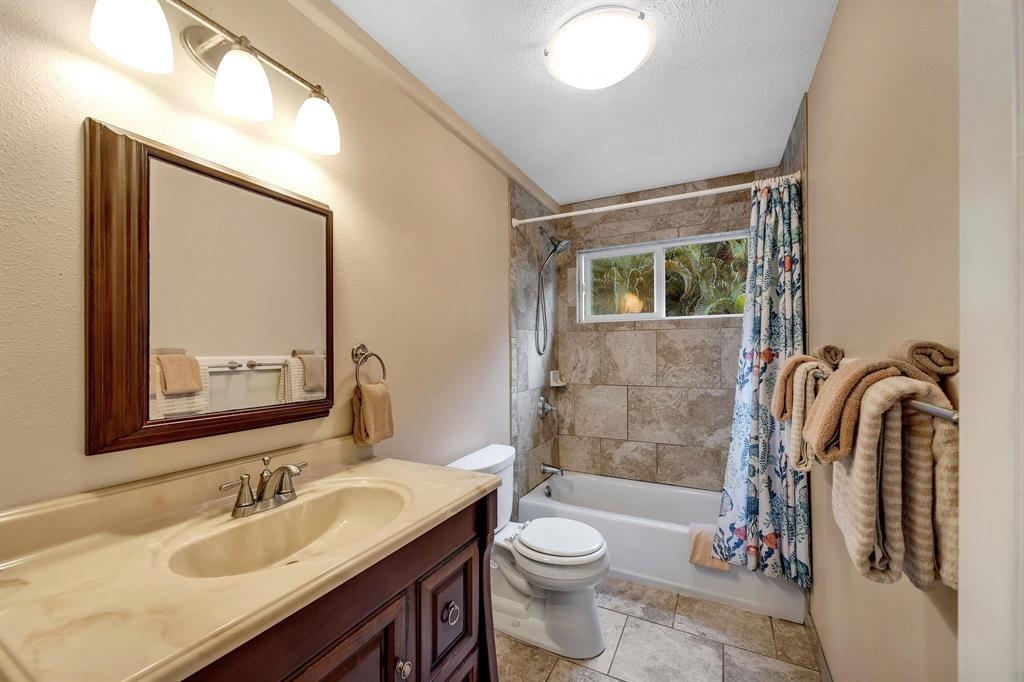 143 Alalele Place Hana, HI 96713 - Photo 21 of 50 a bathroom with a sink vanity mirror and toilet