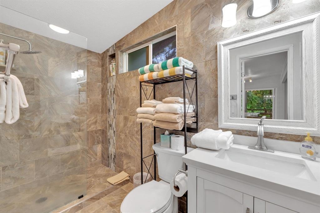 143 Alalele Place Hana, HI 96713 - Photo 38 of 50 a bathroom with a sink toilet a mirror and shower