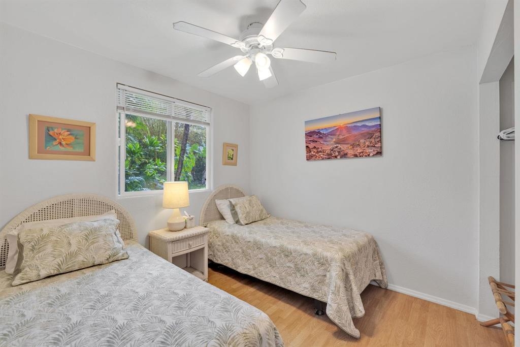 143 Alalele Place Hana, HI 96713 - Photo 43 of 50 a bedroom with a bed and a painting on the wall