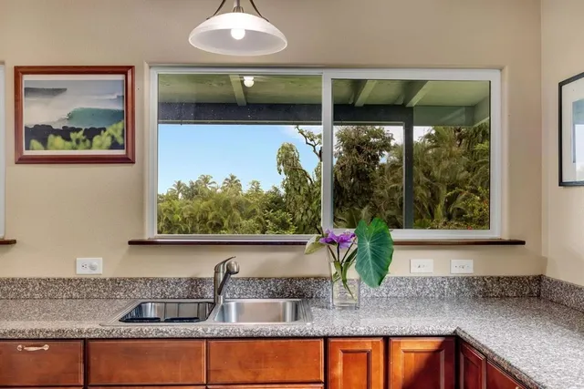 a kitchen with sink and window