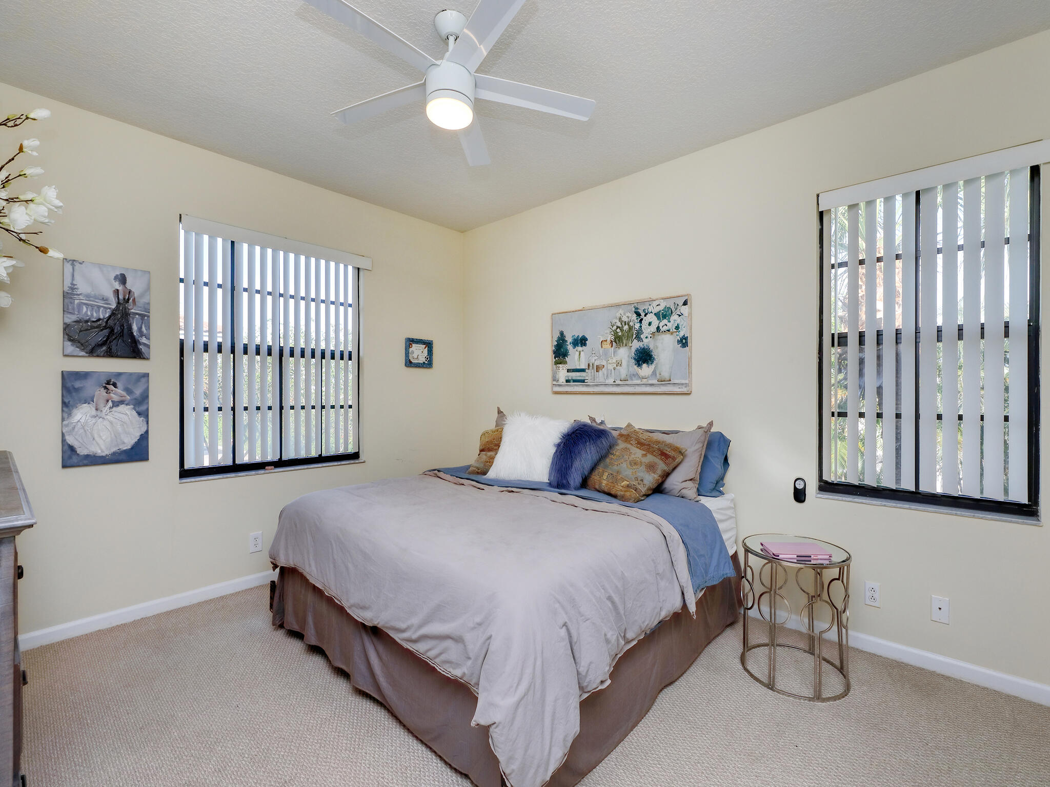 102 Astor Circle Delray Beach, FL 33484 - Photo 15 of 29 a bedroom with a bed and a painting on the wall