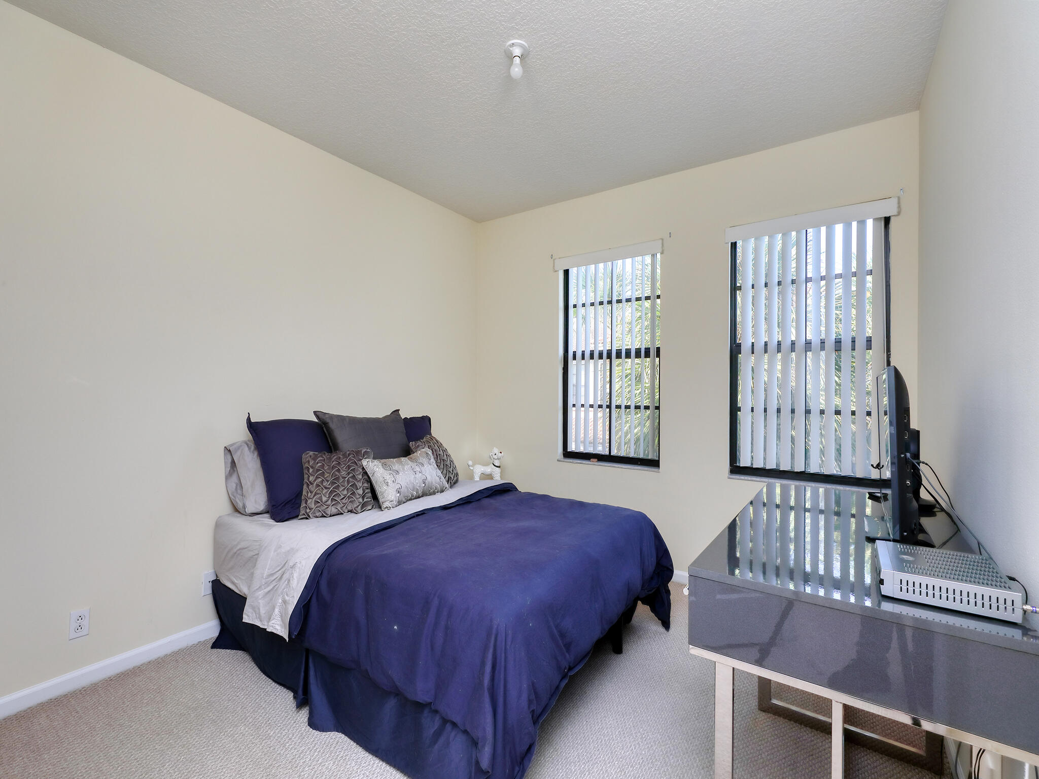 102 Astor Circle Delray Beach, FL 33484 - Photo 18 of 29 a bed room with a bed and a window