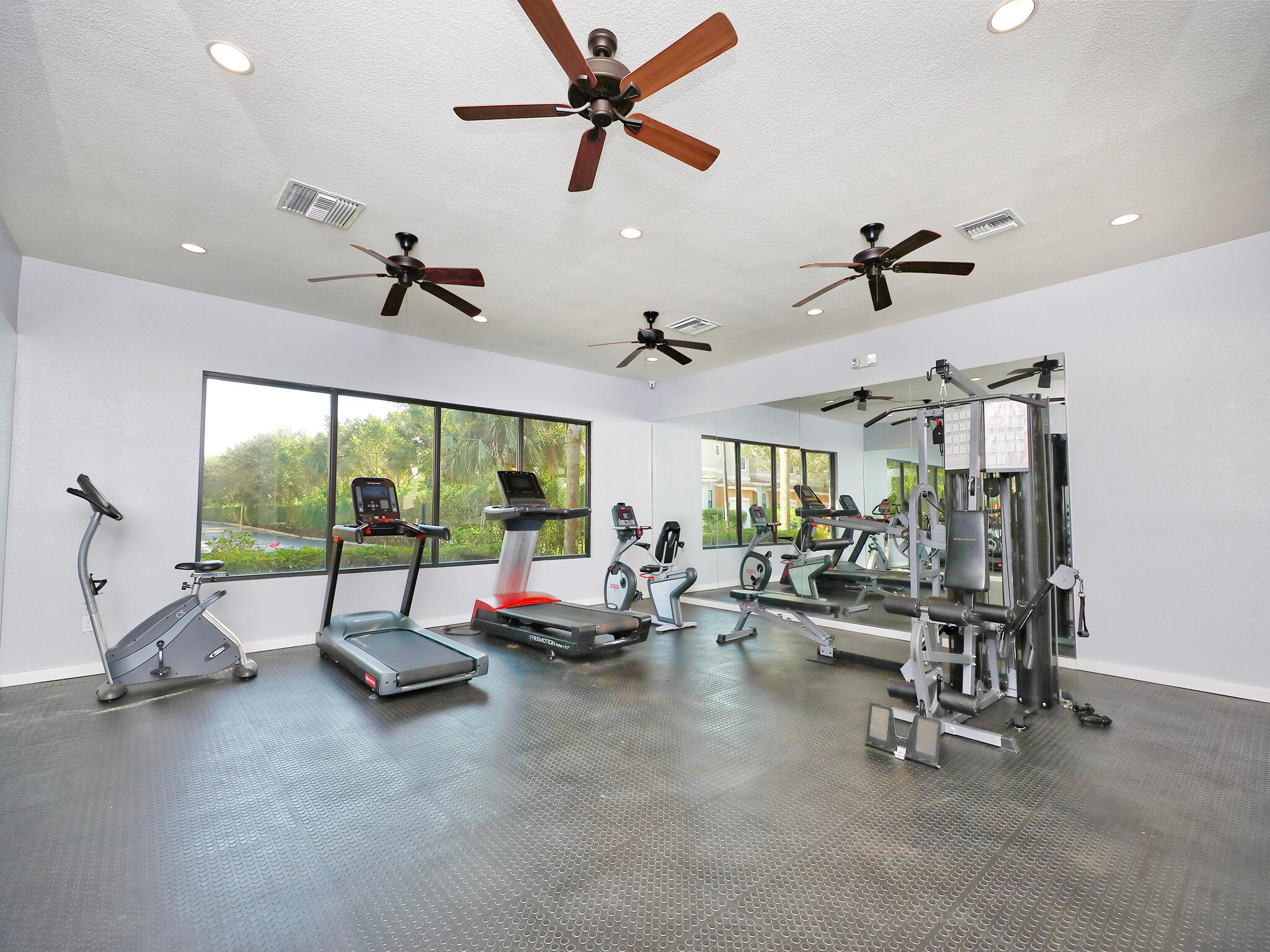 102 Astor Circle Delray Beach, FL 33484 - Photo 29 of 29 a view of a room with gym equipment