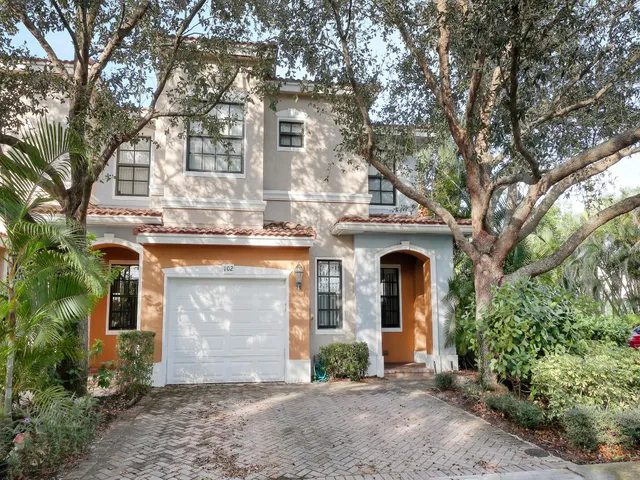 a front view of a house with yard