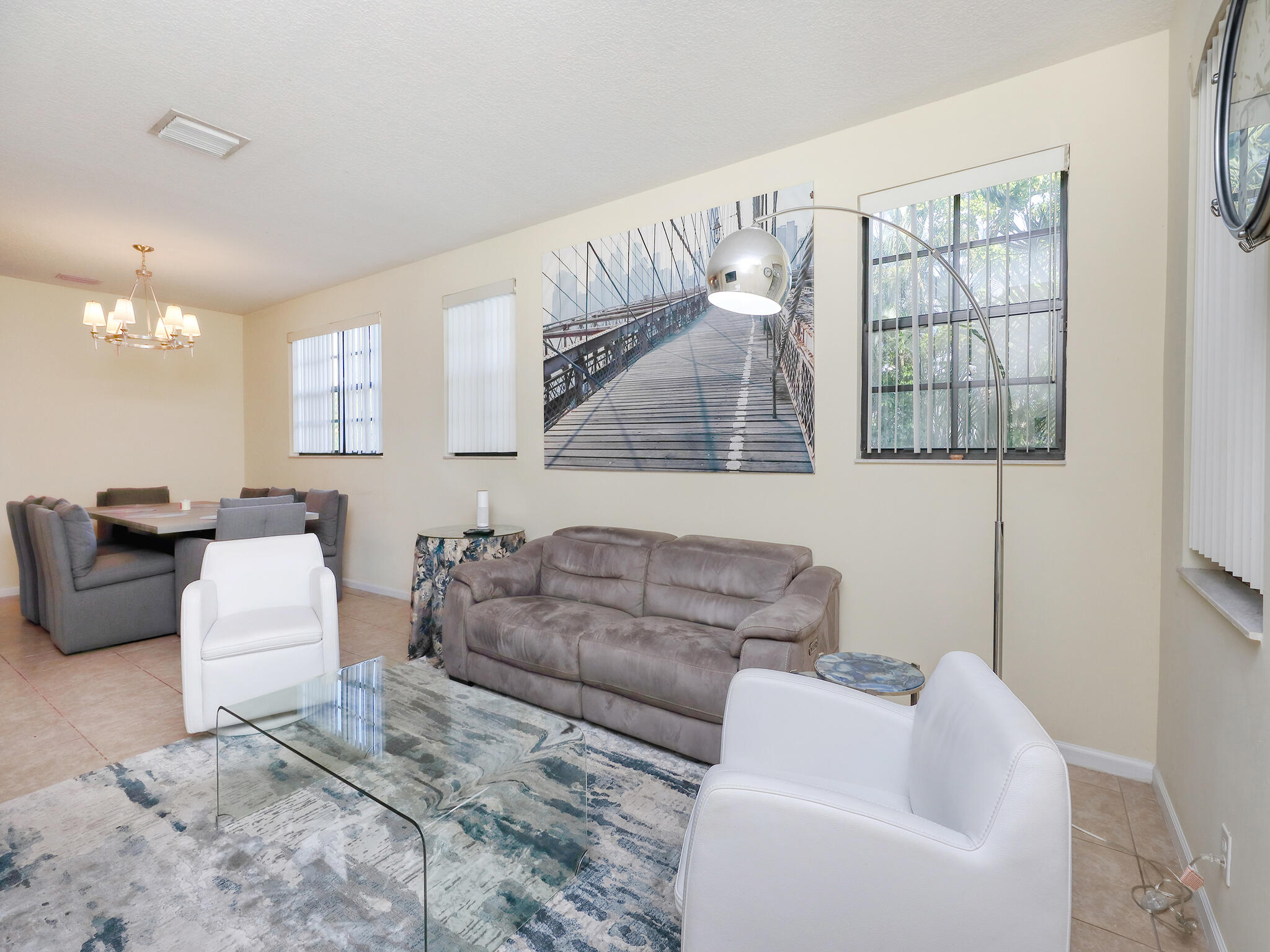 102 Astor Circle Delray Beach, FL 33484 - Photo 5 of 29 a living room with furniture and a window