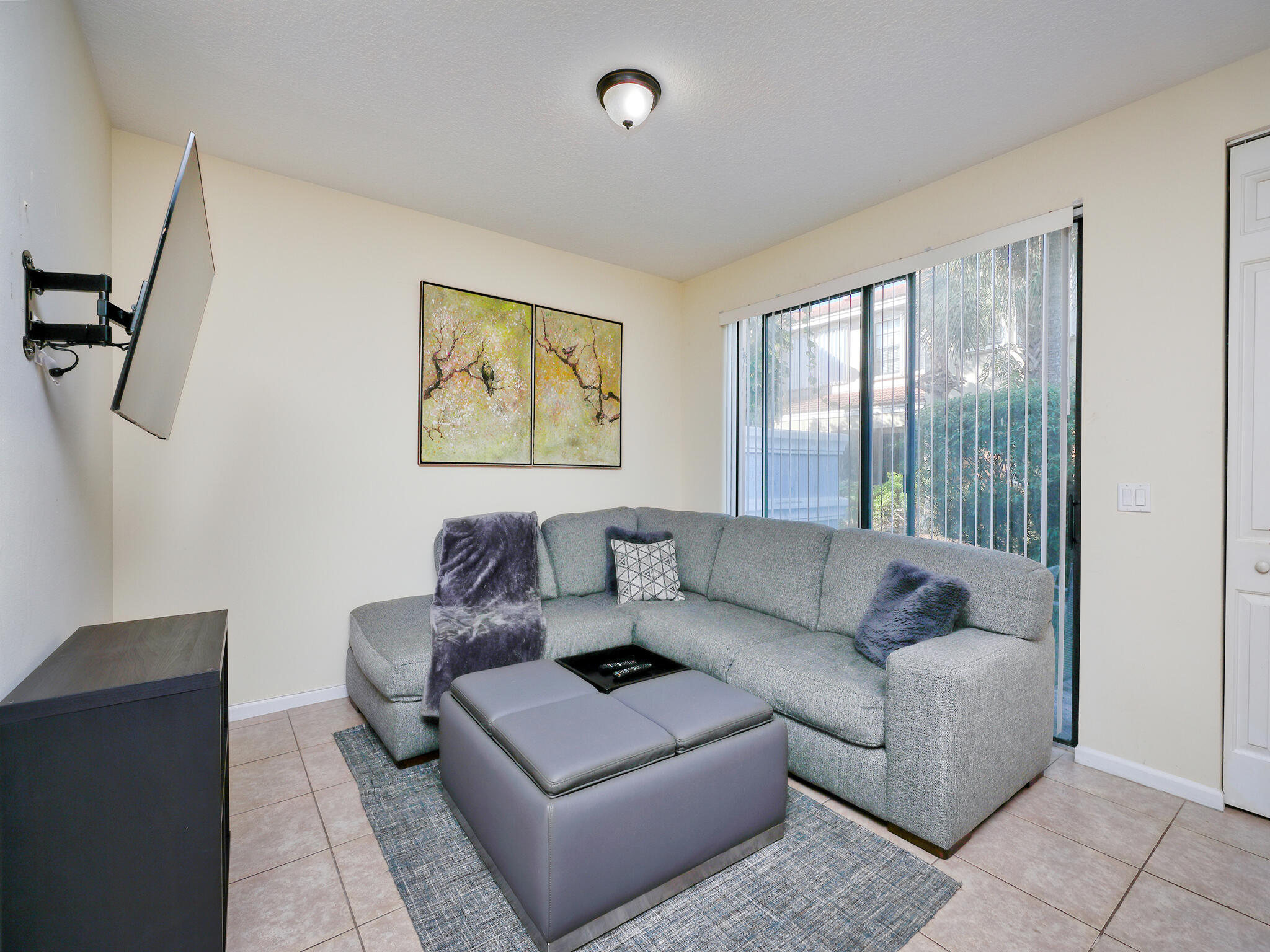 102 Astor Circle Delray Beach, FL 33484 - Photo 10 of 29 a living room with furniture and a large window