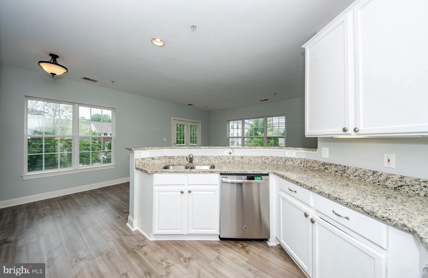 8069 Gatehouse Road, Unit 23 Falls Church, VA 22042 - Photo 11 of 43 a kitchen with a sink cabinets and wooden floor