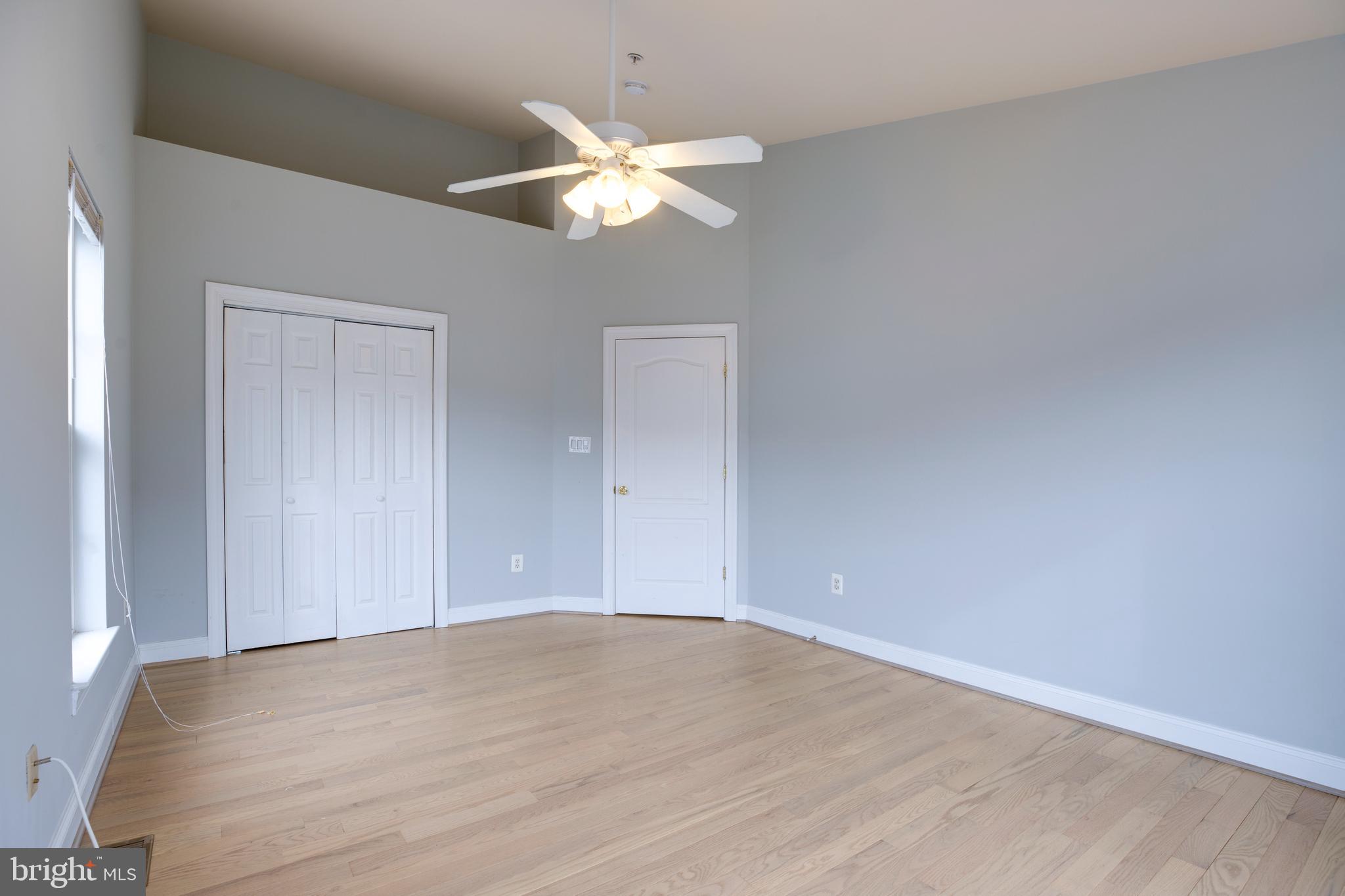 8069 Gatehouse Road, Unit 23 Falls Church, VA 22042 - Photo 28 of 43 a view of an empty room with wooden floor