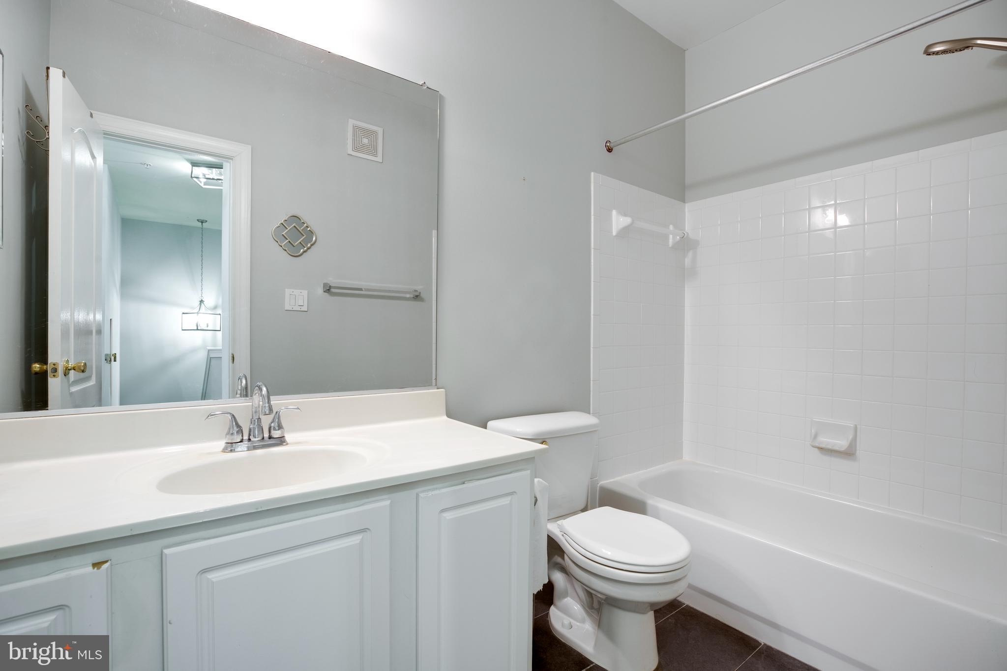 8069 Gatehouse Road, Unit 23 Falls Church, VA 22042 - Photo 36 of 43 a bathroom with a sink a toilet and shower