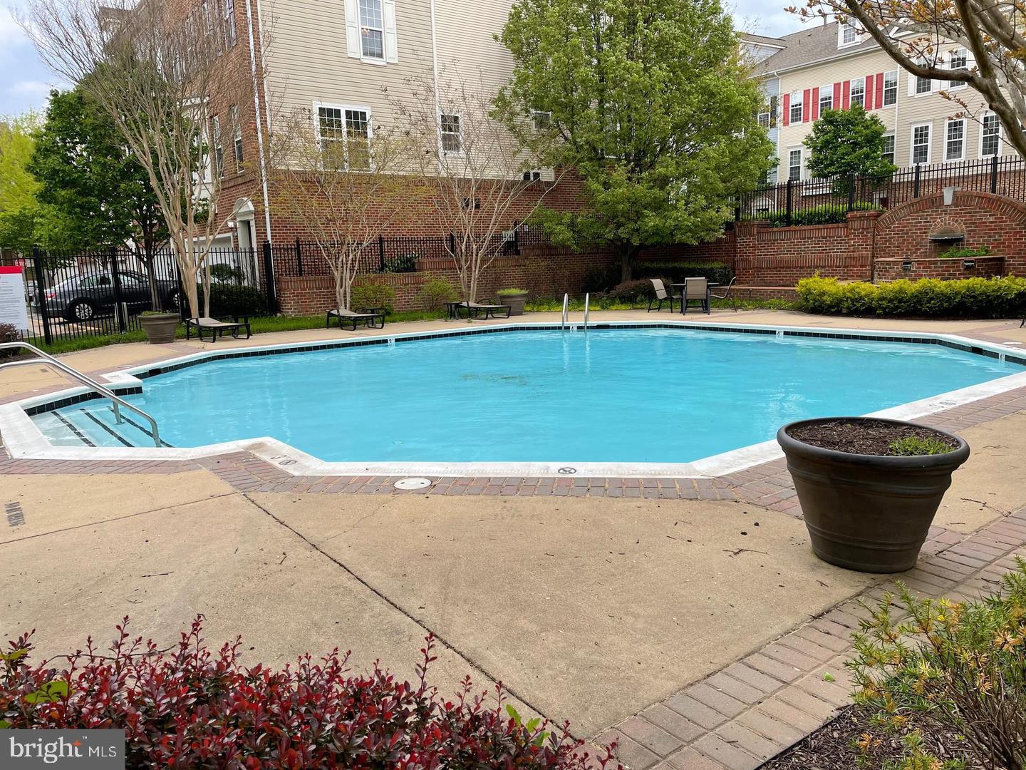 8069 Gatehouse Road, Unit 23 Falls Church, VA 22042 - Photo 42 of 43 a view of a swimming pool with a patio
