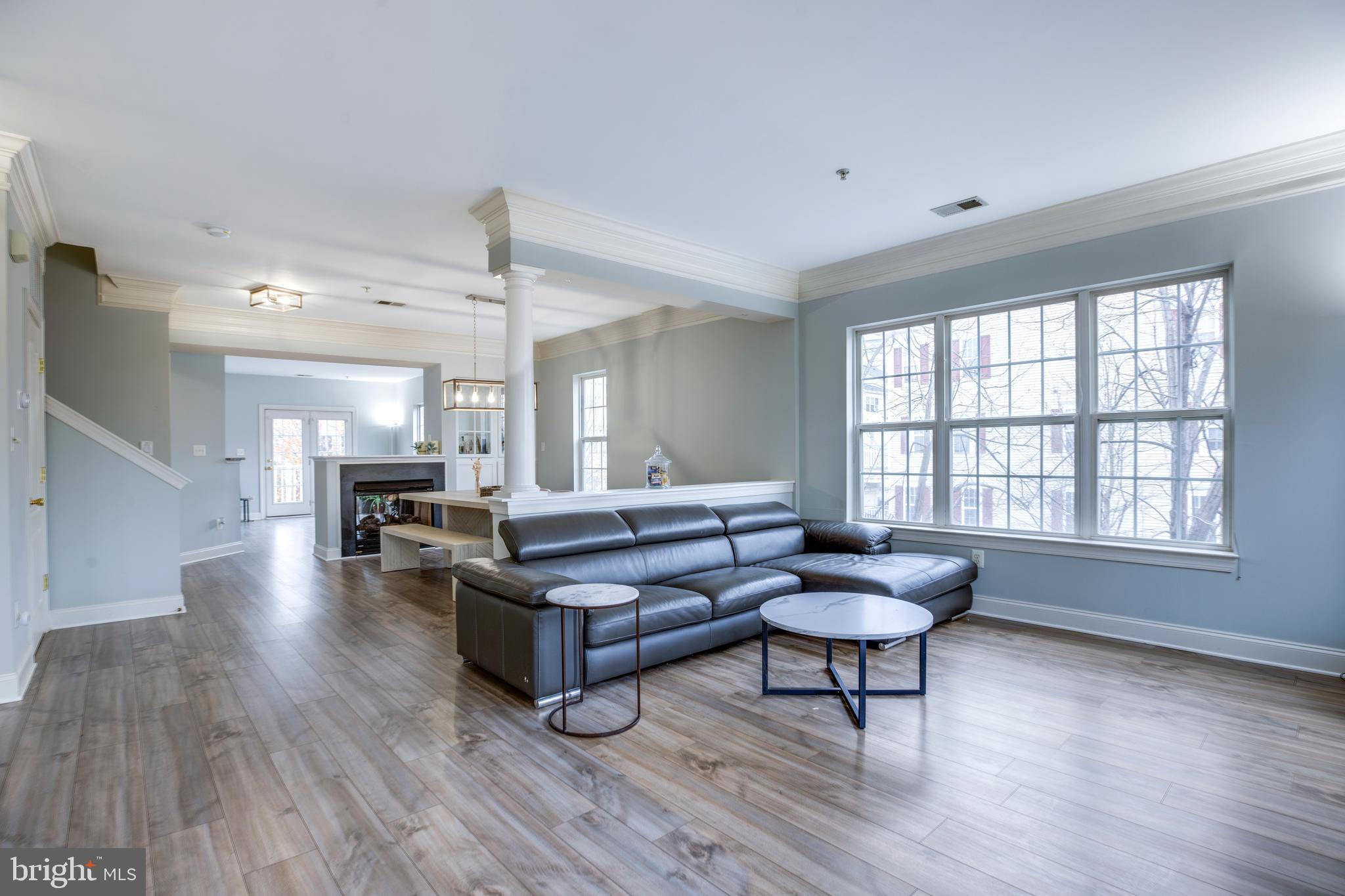 8069 Gatehouse Road, Unit 23 Falls Church, VA 22042 - Photo 5 of 43 a living room with furniture and a large window