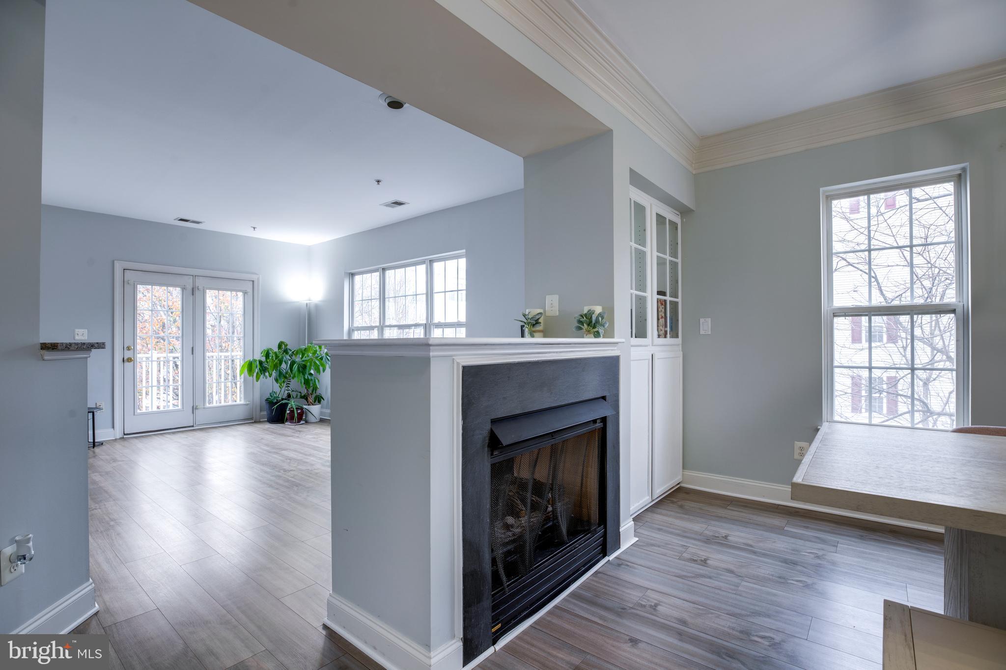 8069 Gatehouse Road, Unit 23 Falls Church, VA 22042 - Photo 7 of 43 a living room with furniture and a fireplace