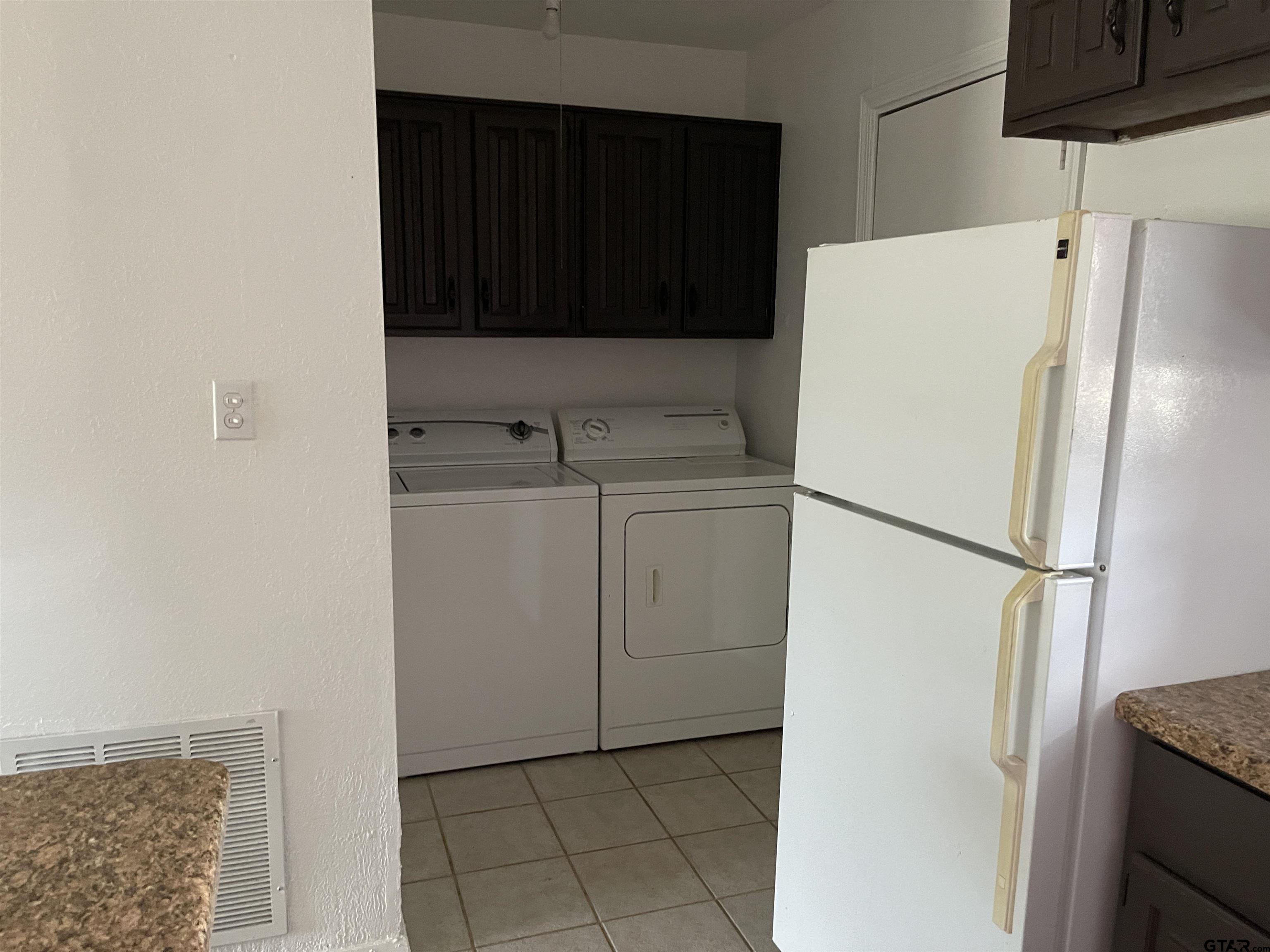 315 Circle Drive, Unit 2 Bogata, TX 75417 - Photo 4 of 11 a white refrigerator freezer and a stove sitting inside of a kitchen