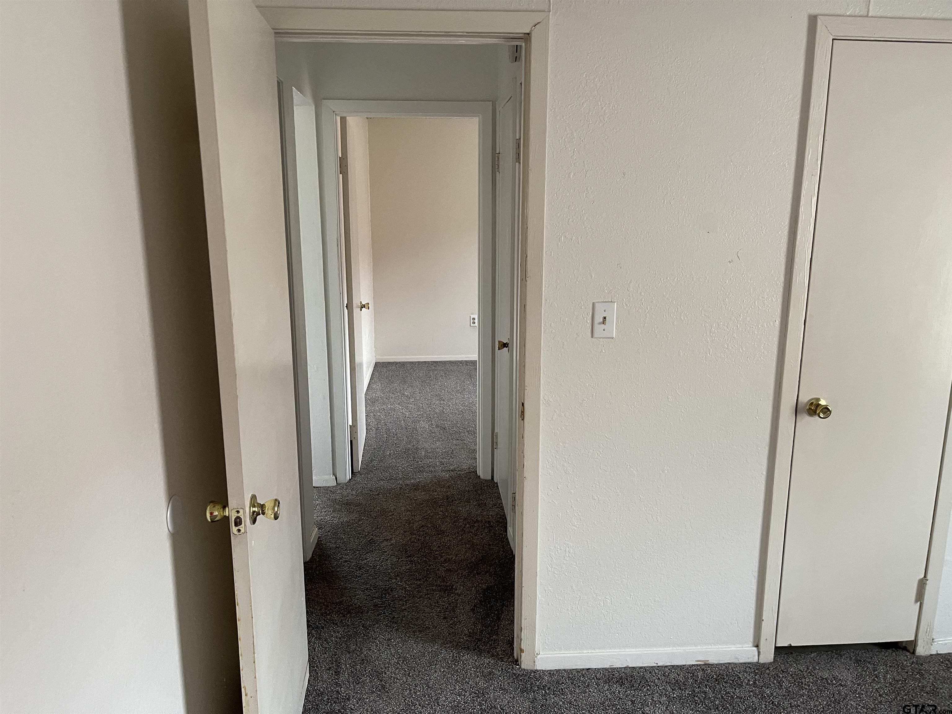 315 Circle Drive, Unit 2 Bogata, TX 75417 - Photo 5 of 11 a view of a bathroom from a hallway