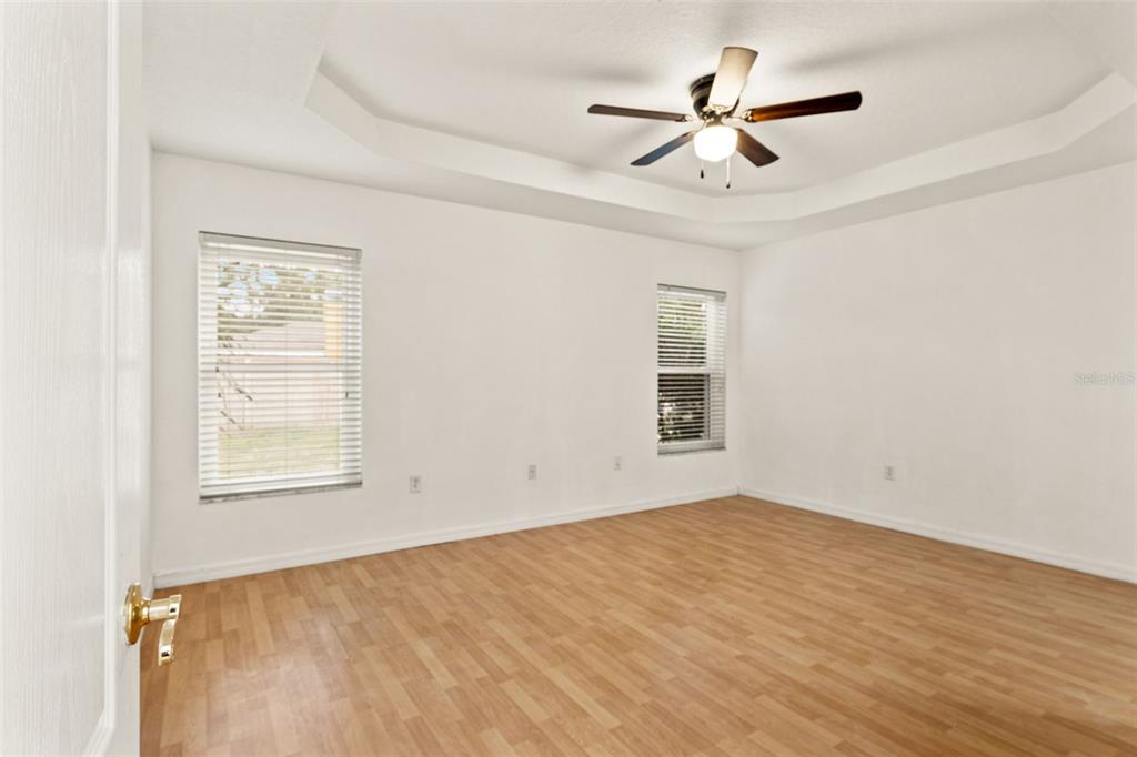 542 Fairbanks Road Spring Hill, FL 34608 - Photo 24 of 45 wooden floor in an empty room with a window
